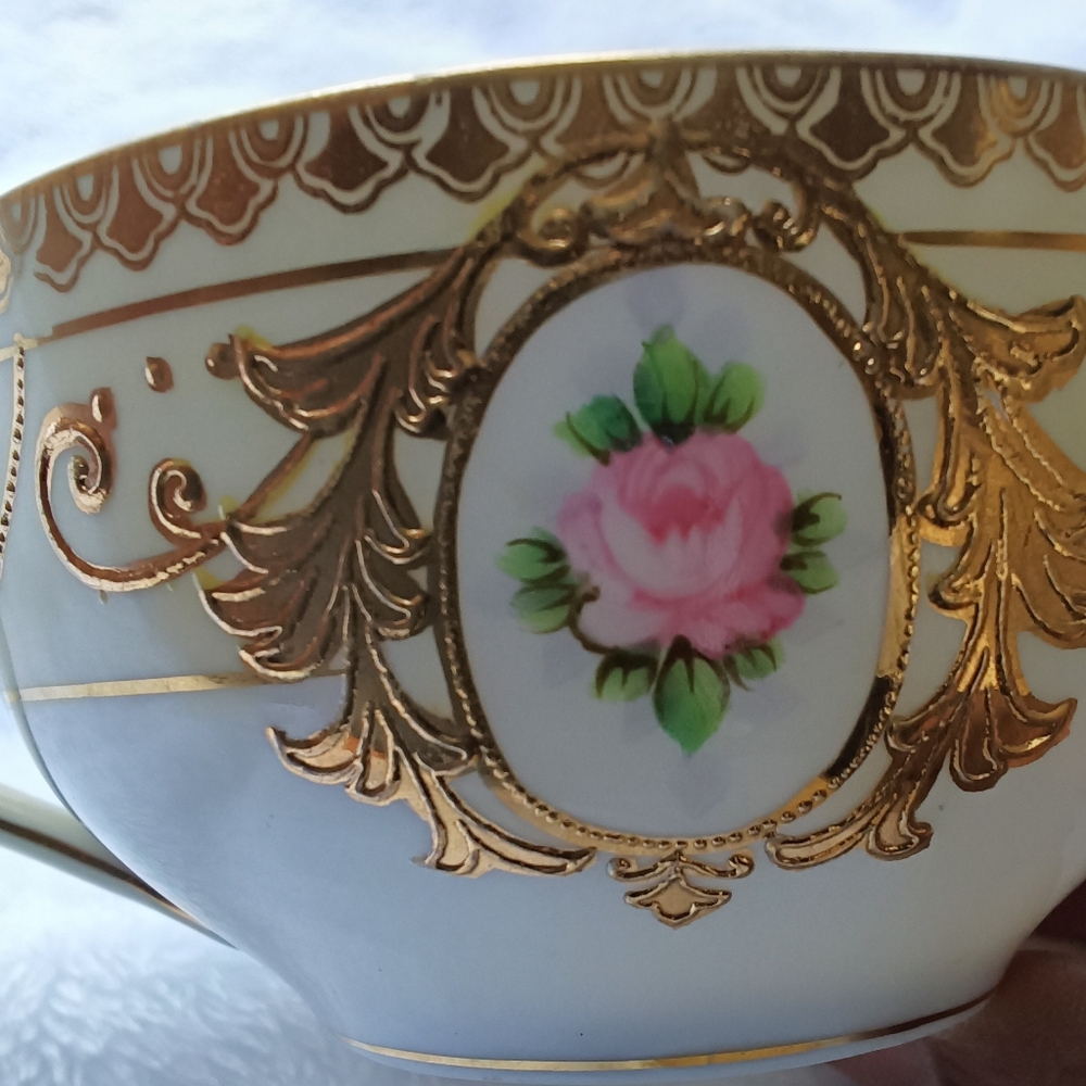 Vintage Tea Cup & Saucer w/ Finger Handle And Raised Gold Design.